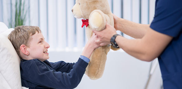 pediatric patient receiving teddy bear