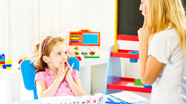 Female child in speech therapy