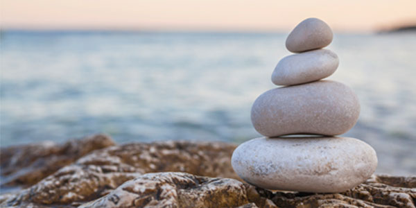 Balanced stone stack on beach