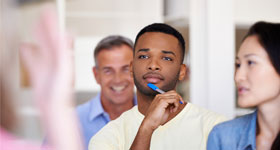 Young African-American man listening to instructor
