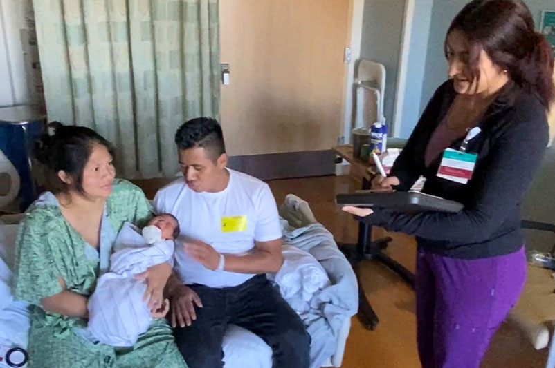 Navigator helping couple with new baby.