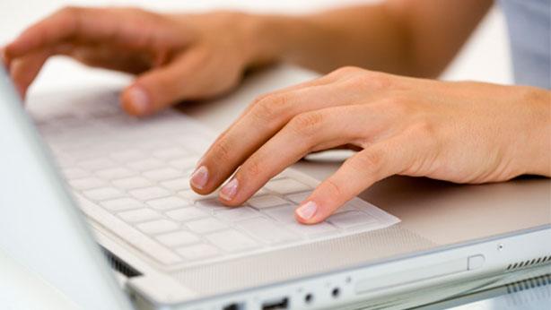 white-female-hands-on-laptop-614x346